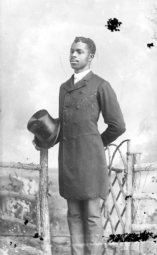 African American man holding a top hat