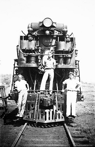 Three African American men on a locomotive